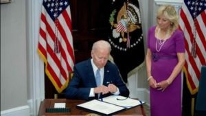 ‘Do something’: Joe Biden signs rare bipartisan gun control legislation