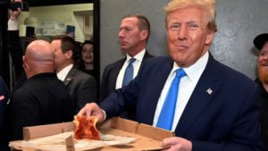 'Does anybody want a piece that I've eaten?' Trump offers half-eaten pizza to fans